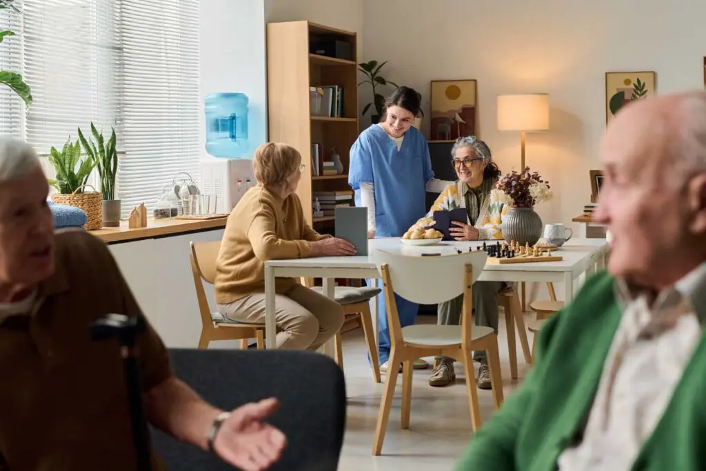 Wide,Shot,Of,Senior,Women,Meeting,With,Female,Caregiver,In
